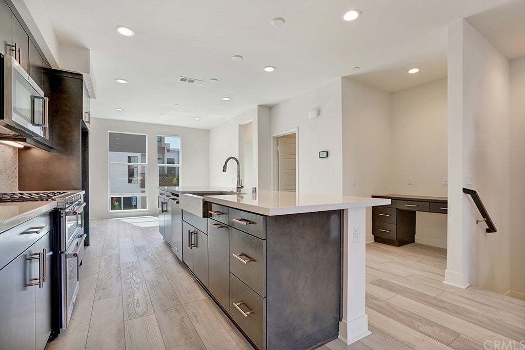 Modern kitchen in a 17 West condo for sale in Costa Mesa, California